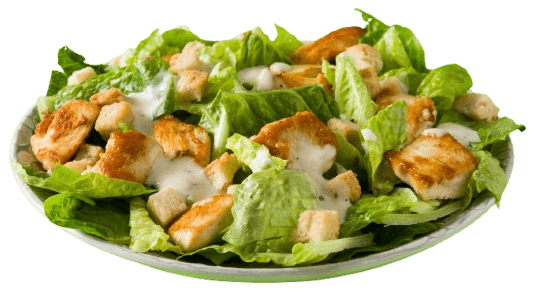 Fresh Caesar salad with crispy lettuce, grilled chicken, croutons, and creamy dressing on a white plate.